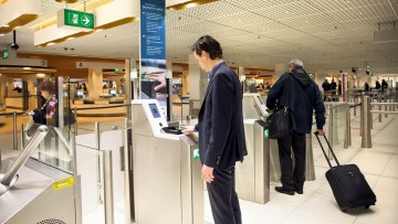 Self-service passport control with biometric technology at Amsterdam’s Schiphol Airport