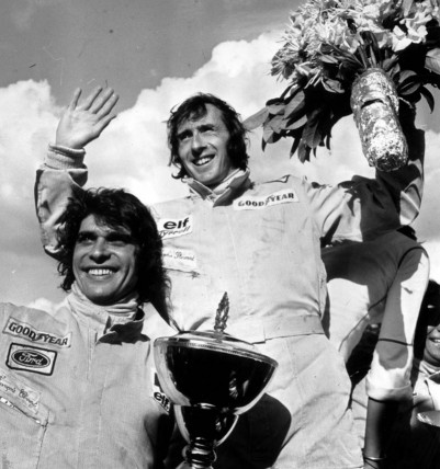 Stewart (right) with Tyrrell teammate Francois Cevert on the podium after winning the Belgian Grand Prix in 1973