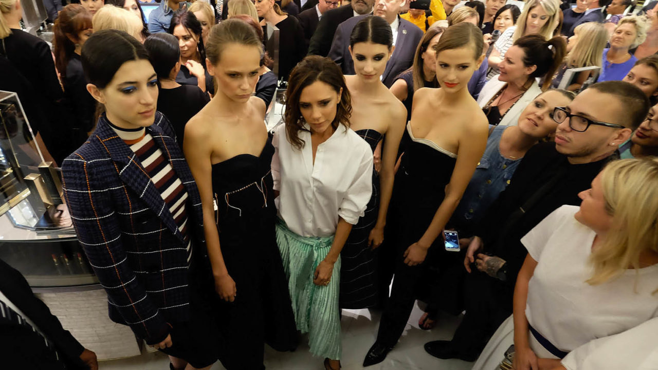 Victoria Beckham with models at a fashion show
