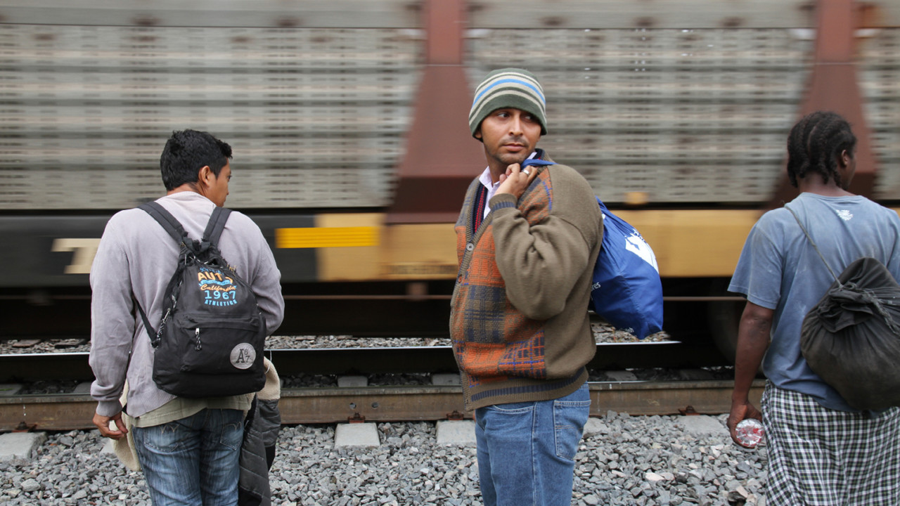 Migrants wait for La Bestia, the frieght train used to hitch a perilous ride north