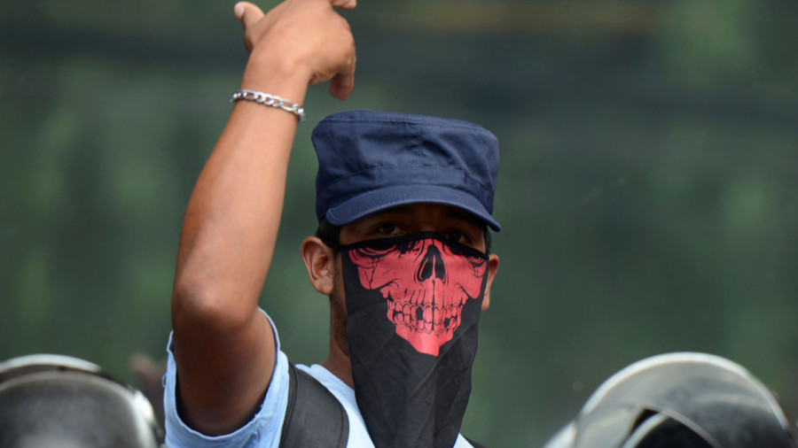 A Honduran peasant demonstrates outside the Public Ministry against the fatal shooting of a rural leader