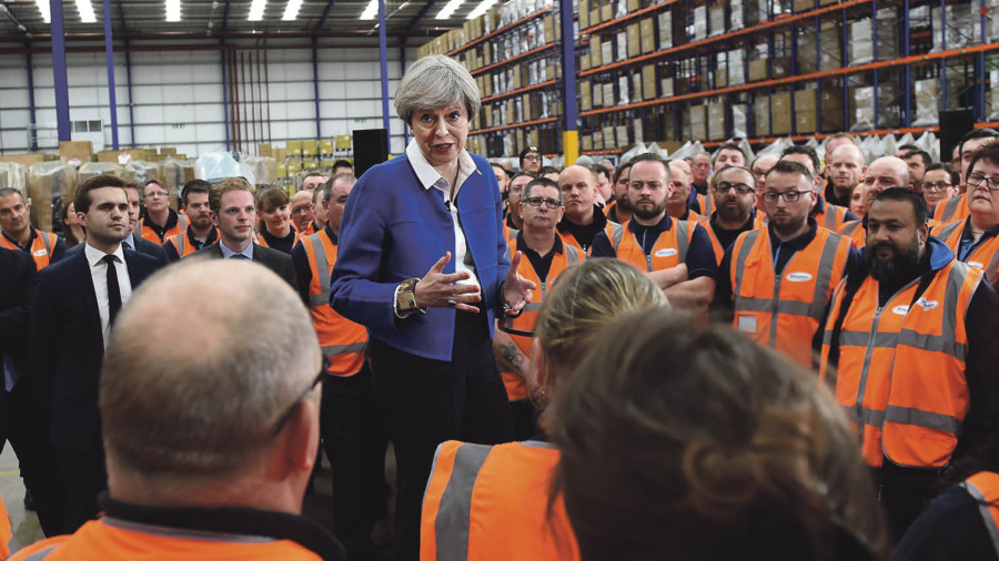 Political risk in UK business: Theresa May at a questionand-answer session with workers at Screwfix in Stoke-on-Trent during the Conservatives’ general election campaign