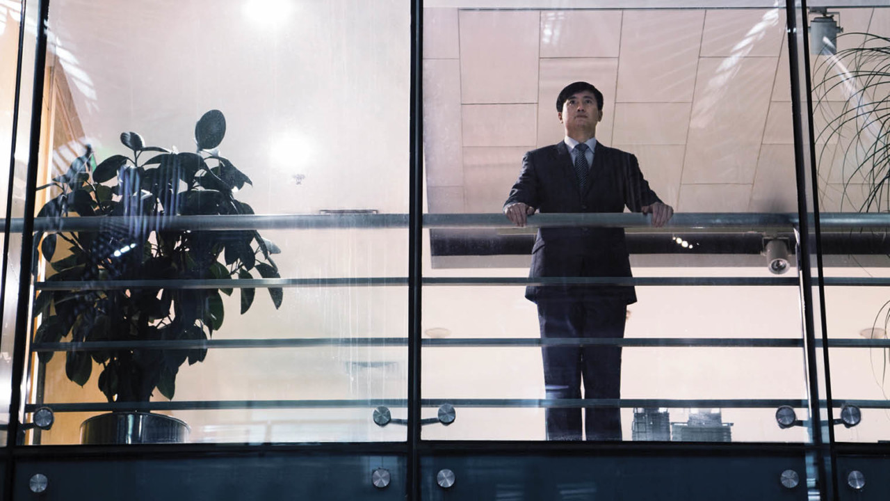 Business leader looking out of window