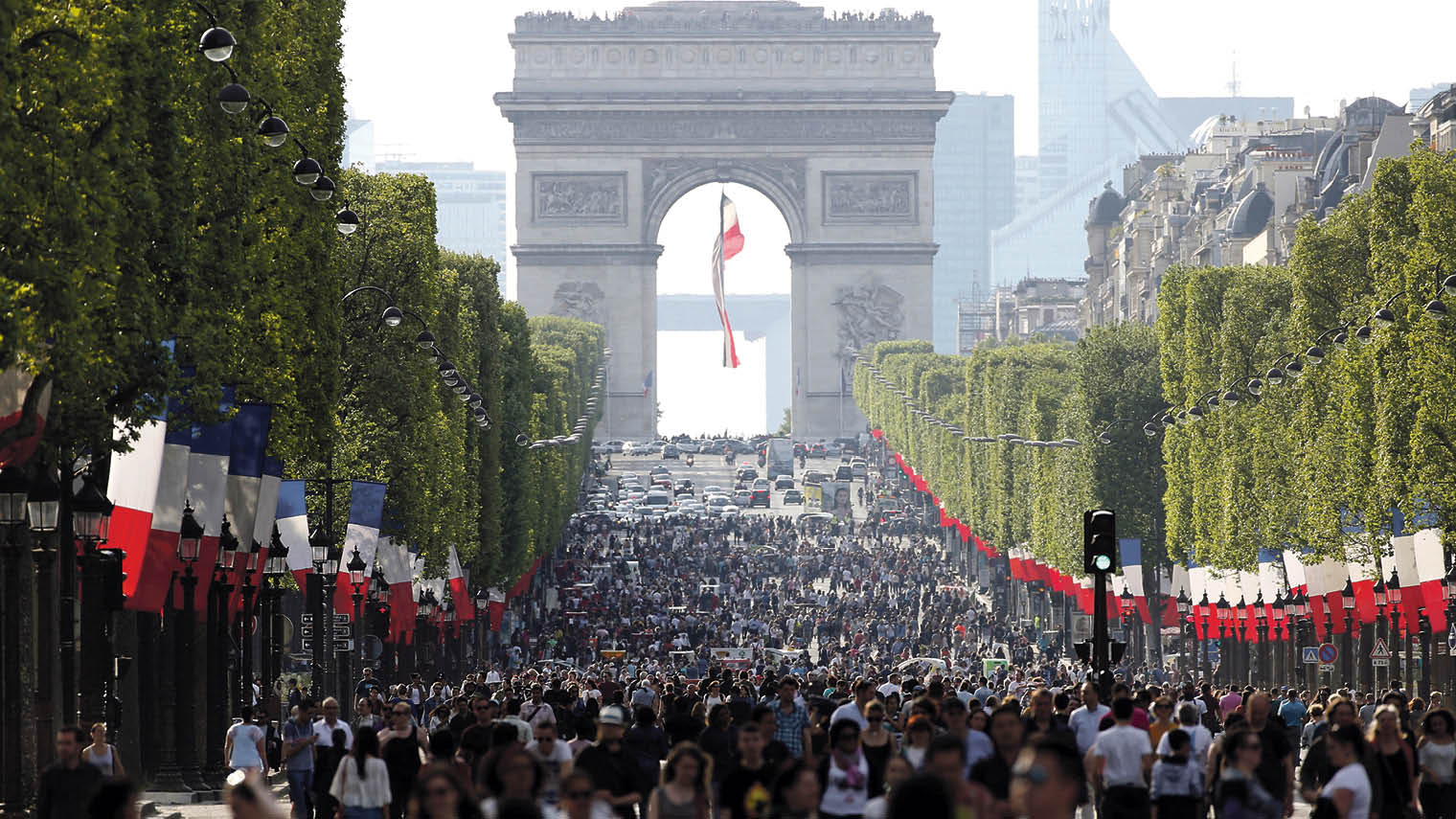 Pedestrians on the Champs-Élysées in Paris as the world-famous shopping street went car-free for a day last May to tackle pollution in the French capita