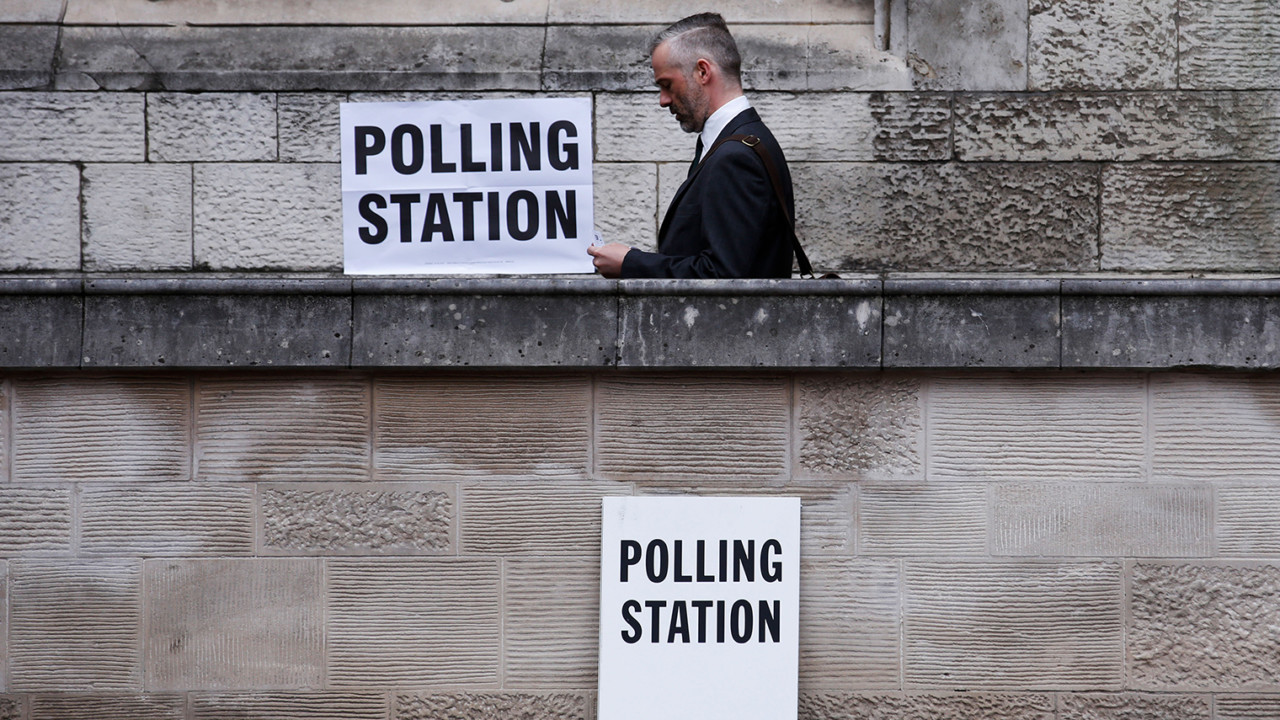 A voter leaves a polling station after casting his vote in the general election at St Giles Church in London, U.K., on Thursday, June 8, 2017. Britons vote today after an election dominated by Brexit, austerity and in the closing phases, security. Photographer: Luke MacGregor/Bloomberg via Getty Images
