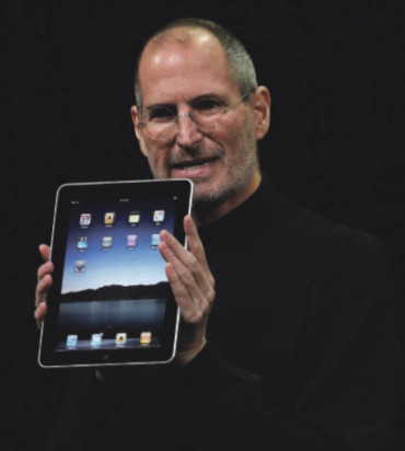 Steve Jobs holding iPad