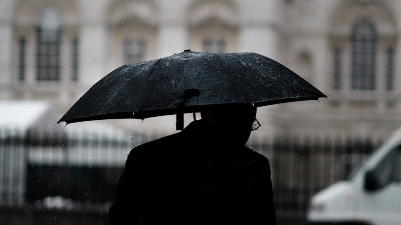 Man with umbrella black and white