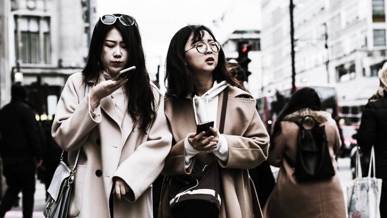 Women on oxford street using phones