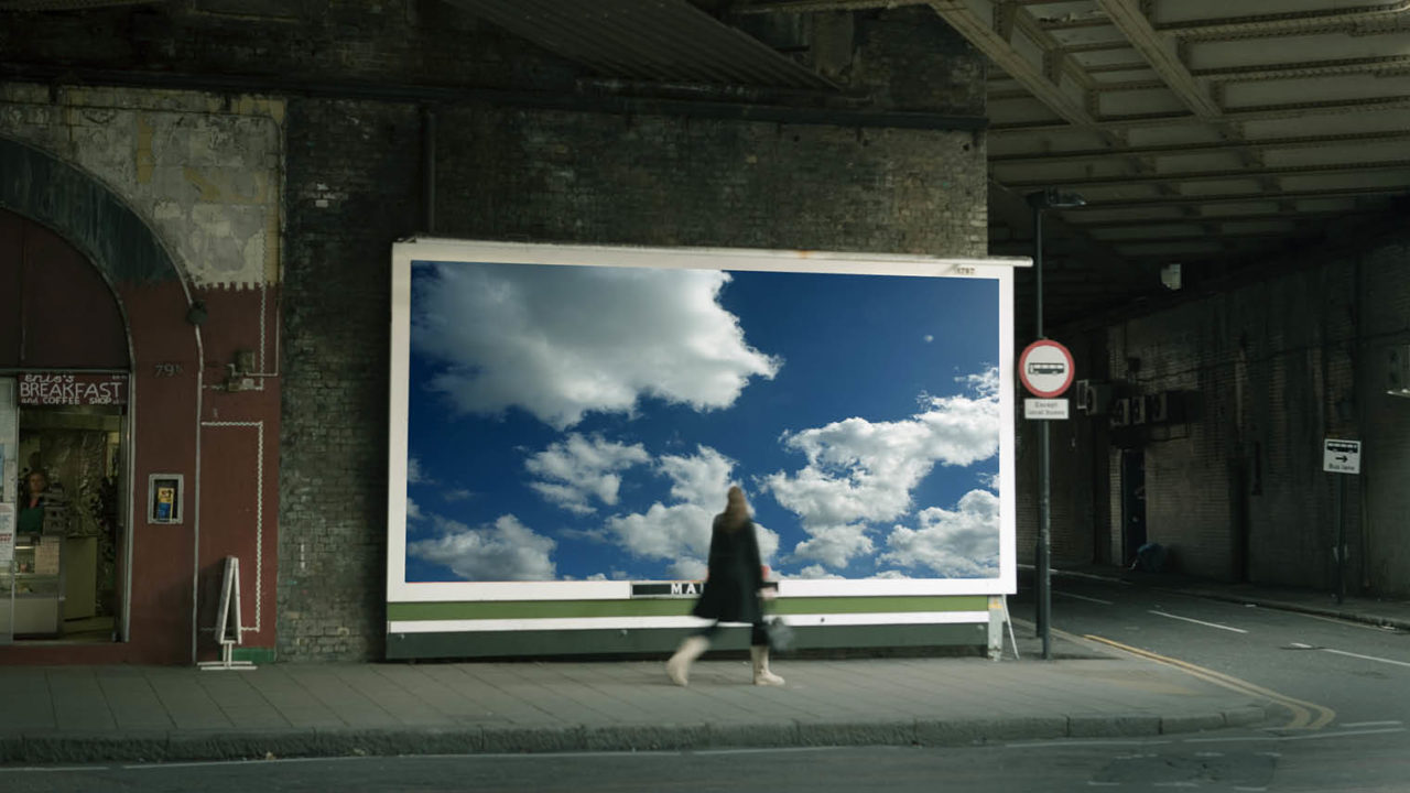 digital agencies woman on street passing billboard