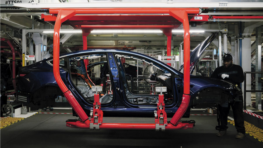 electric cars being built in factory