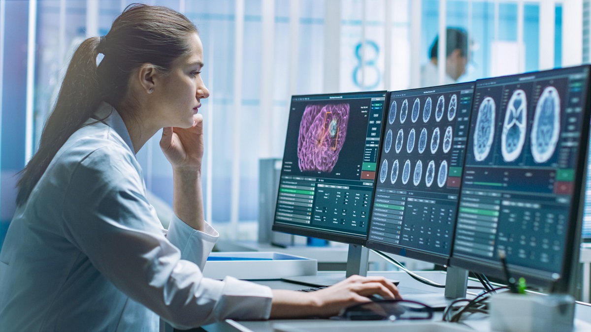 Female Medical Research Scientist Working with Brain Scans on Her Personal Computer. Modern Laboratory Working on Neurophysiology, Science, Neuropharmacology. Understanding Human Brain.