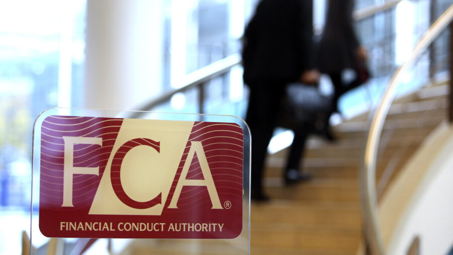 The FCA logo in the foreground, while visitors walk up the stairs in the background