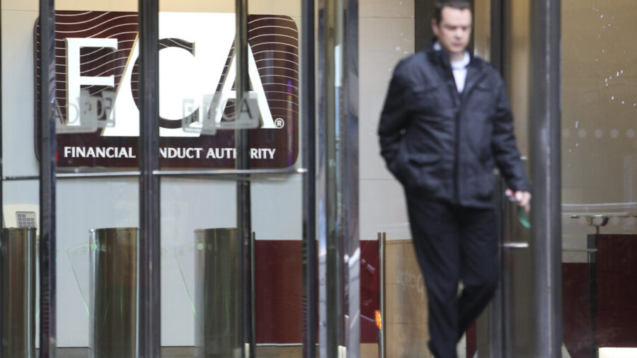A person exits the FCA headquarters