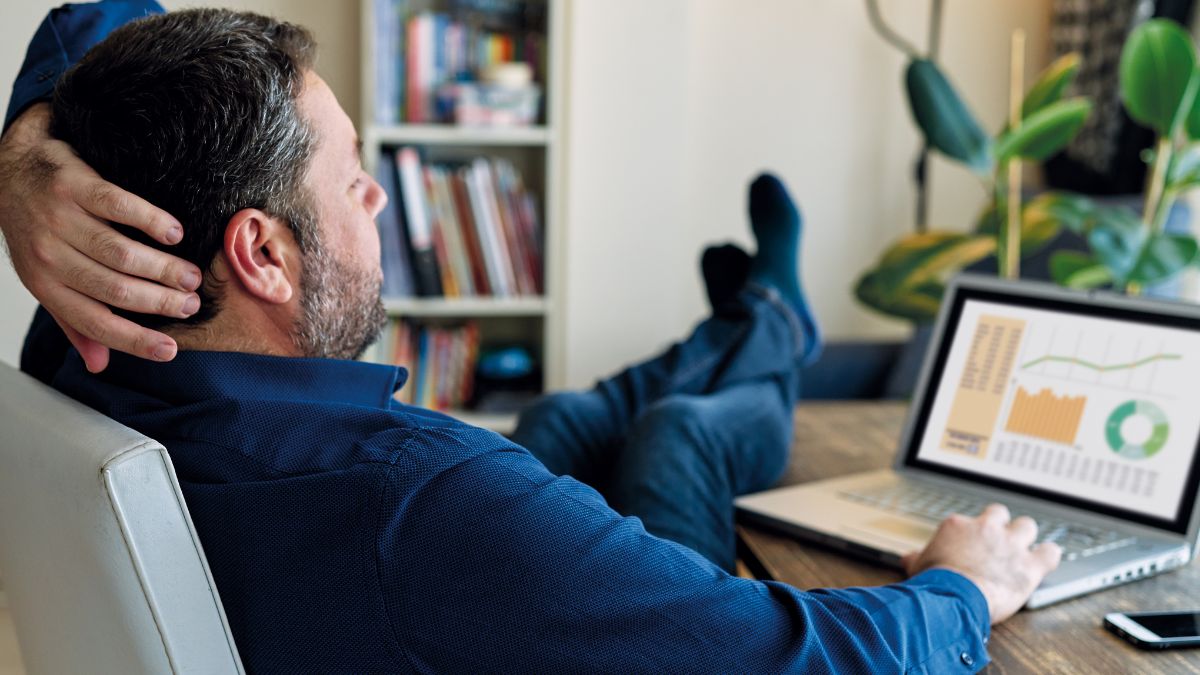 Remote CEO puts his feet up while hybrid working