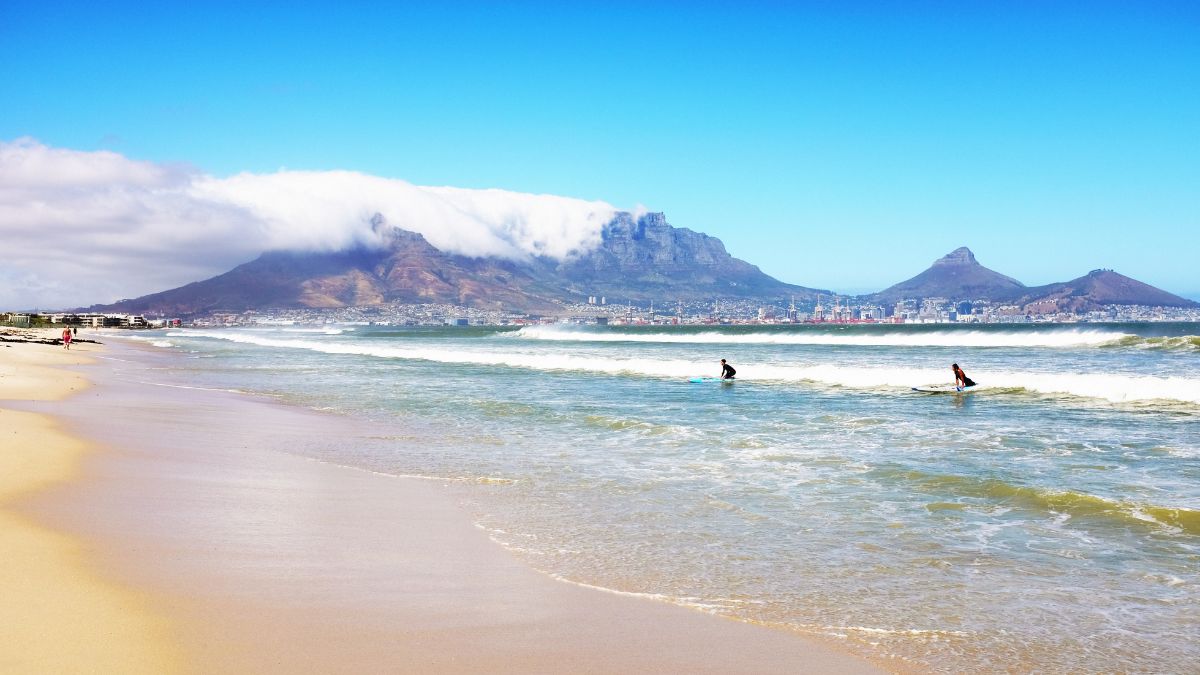 Two South Africans surfing with Table Mountain in the background