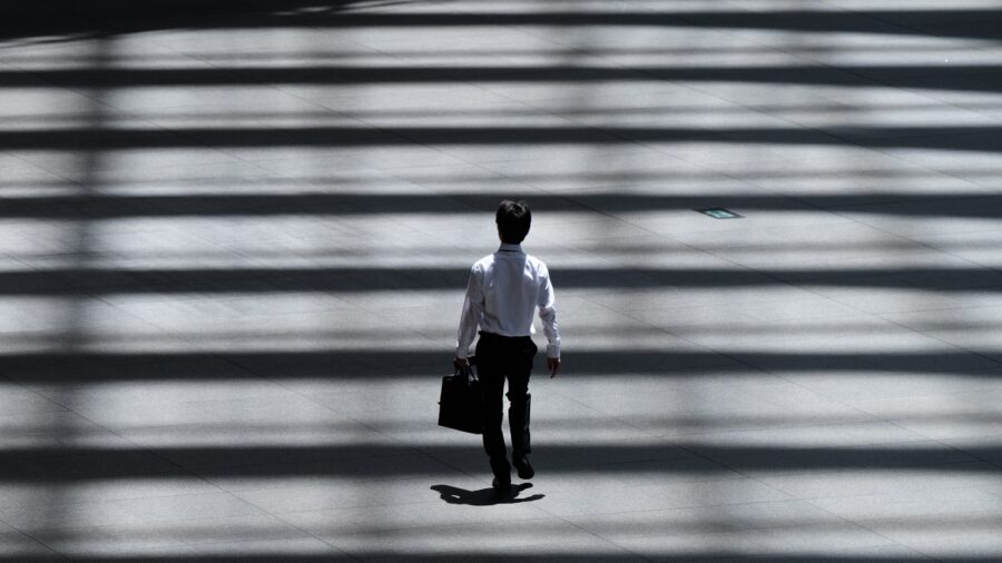 Entrepreneur's Mindset
Man in suit walking into the light