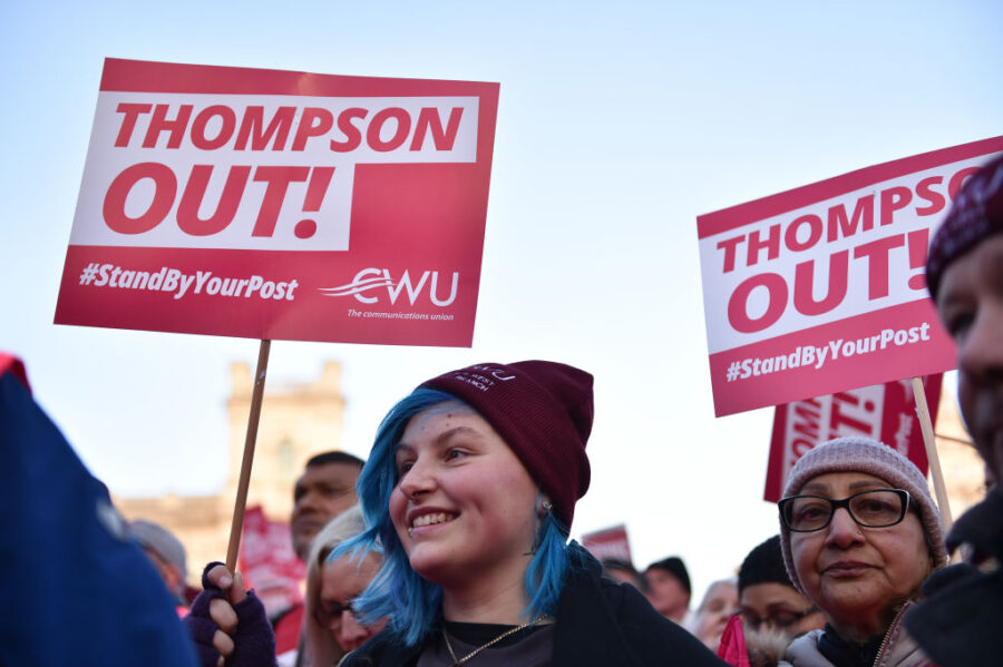Protesters Hold Placards Saying "thompson Out" During The