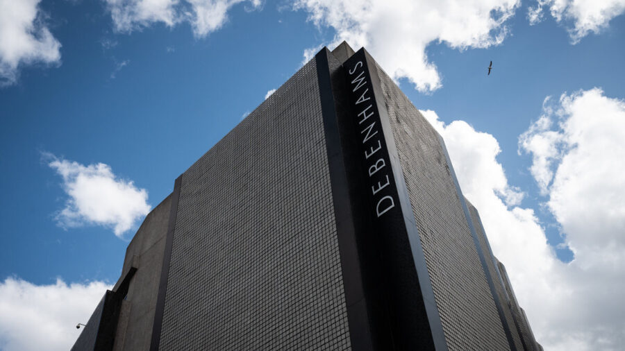 Debenhams' former flagship store on Oxford Street stands shuttered against a blue sky