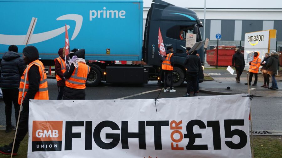 An Amazon Lorry Passes A Picket Line During A Strike Over Pay At The Amazon.com Inc. Fulfilment Centre In Coventry Uk
