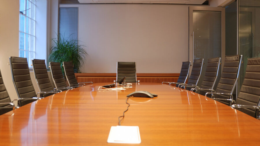 A shot down the table of a large conference room