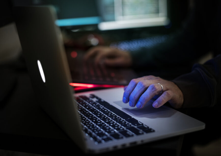 Hacker Working On Computer
