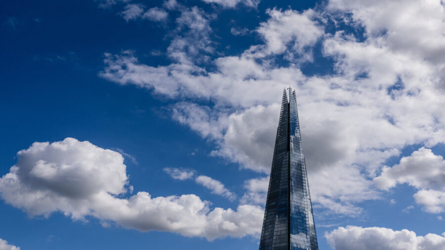 The Shard, London, against a blue sky with white clouds