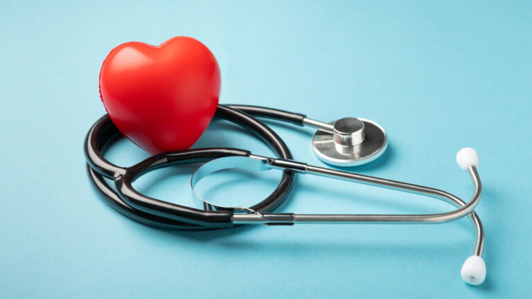 Black Stethoscope And Red Heart On A Blue Background